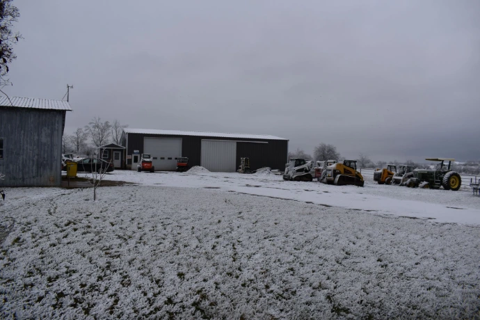 Shop or garage with tractors and snow